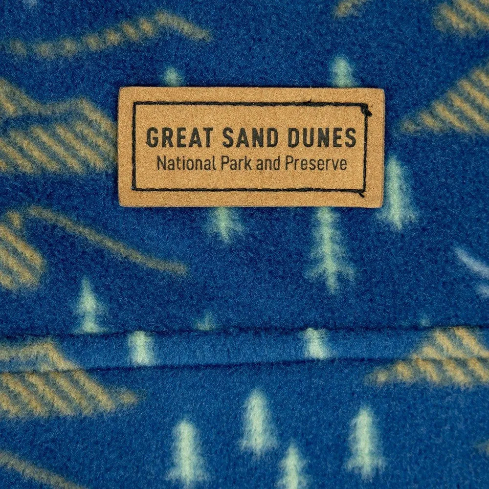 Fabric with 'Great Sand Dunes National Park and Preserve' label on a blue background