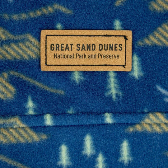 Fabric with 'Great Sand Dunes National Park and Preserve' label on a blue background