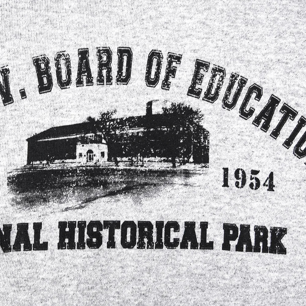 Vintage-style graphic with a building and text 'Board of Education National Historical Park 1954' on a gray background.