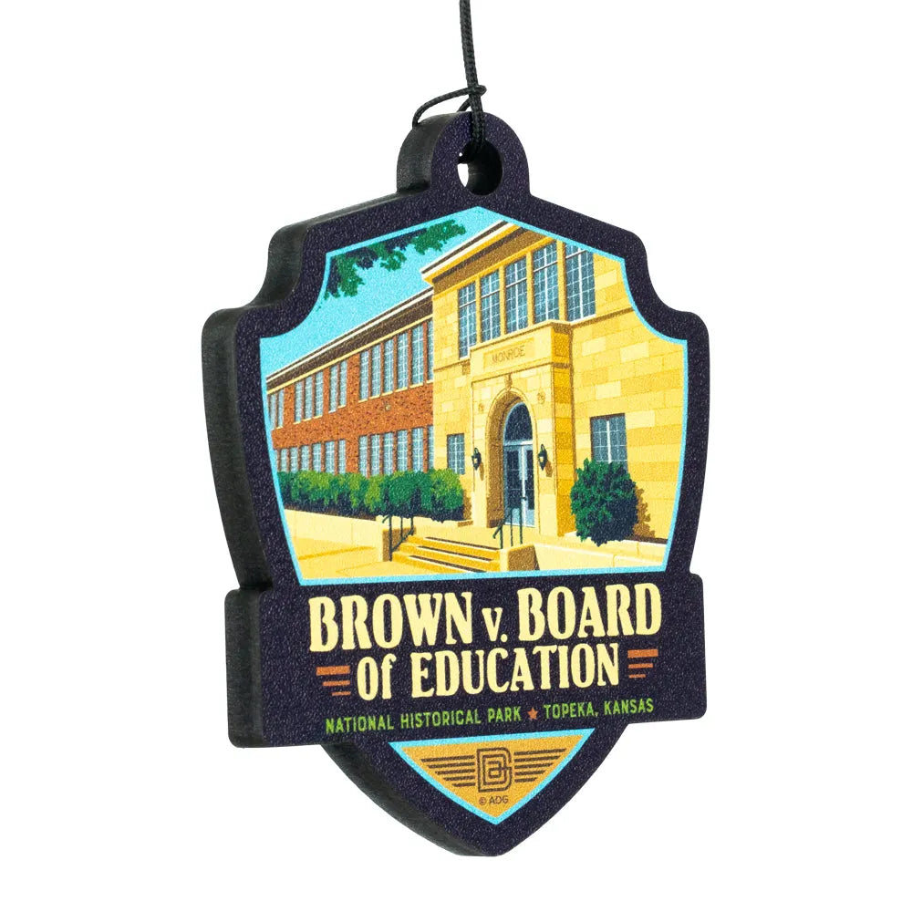 Decorative ornament with a building illustration and text about Brown v. Board of Education National Historical Park.