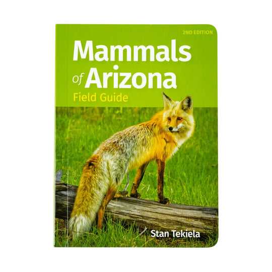 Mammals of Arizona Field Guide 2nd Edition book by Stan Tekiela, featuring a bright green cover with a photo of a red fox standing on a log in a grassy field.