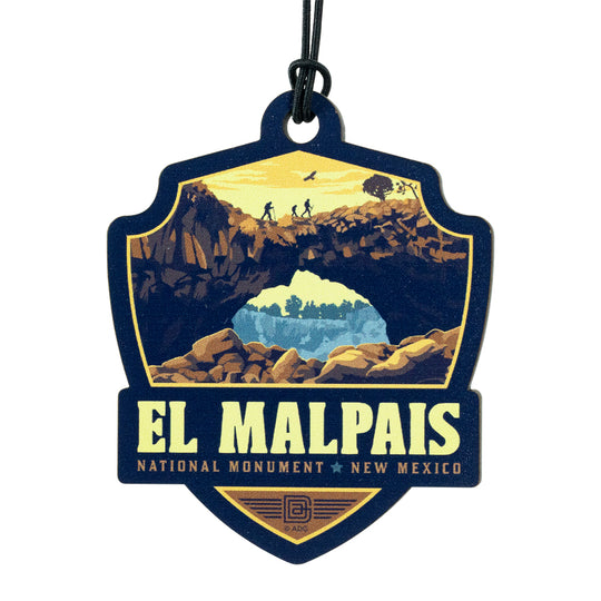 Lanyard badge with El Malpais National Monument design on a white background