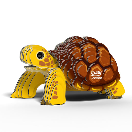 3D cardboard puzzle of a tortoise with yellow shell and brown back on a white background