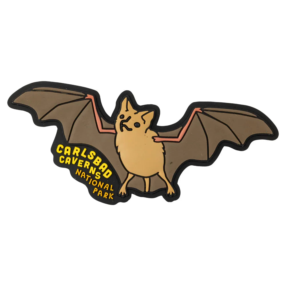 Bat-shaped magnet with 'Carlsbad Caverns National Park' text on a white background