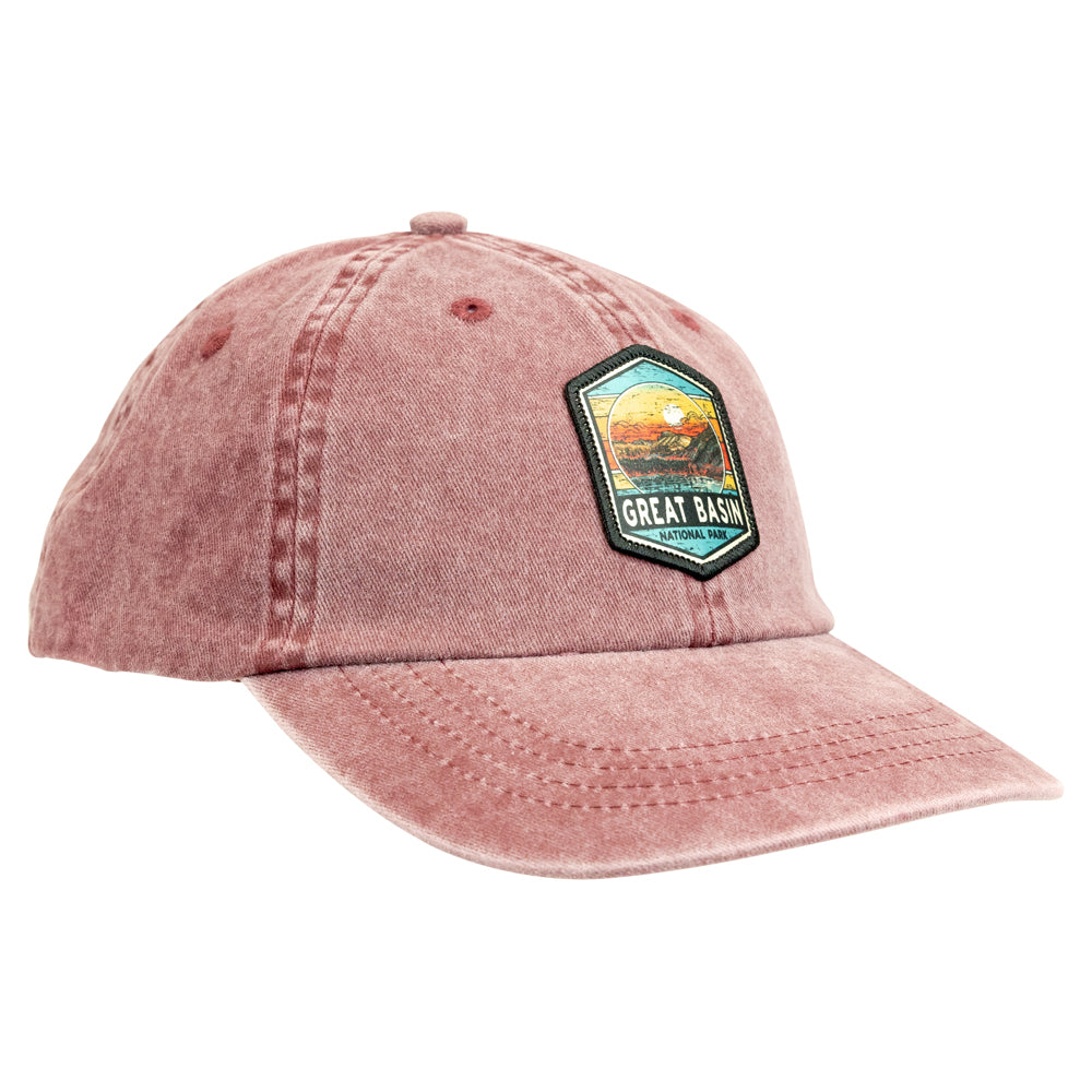 Distressed red cap with a patch featuring a landscape and 'Great Basin' text on a white background
