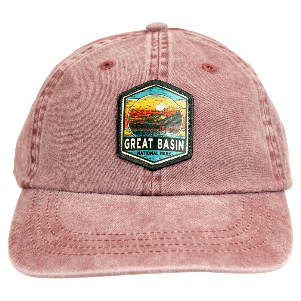 Distressed red cap with Great Basin National Park patch on a white background