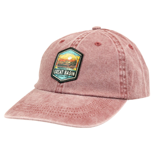 Distressed red cap with a Great Basin National Park patch on a white background