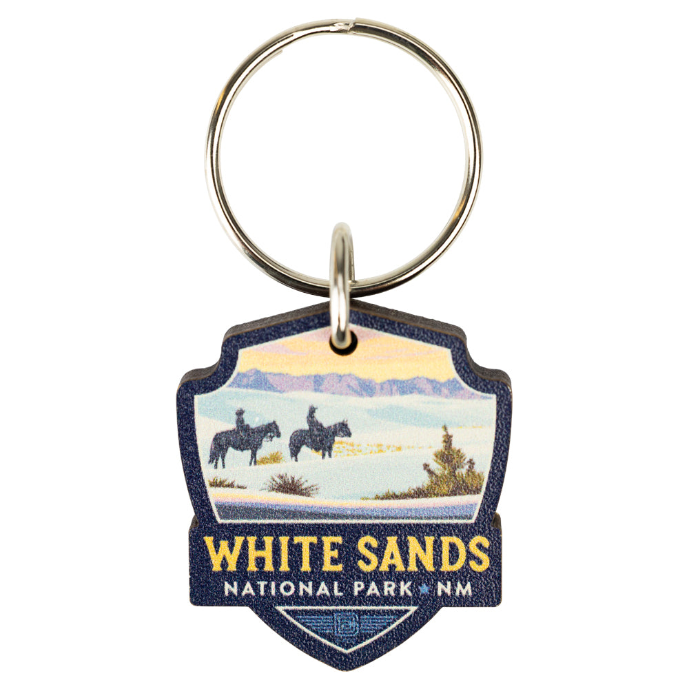 Keychain with White Sands National Park design featuring two people on horses.