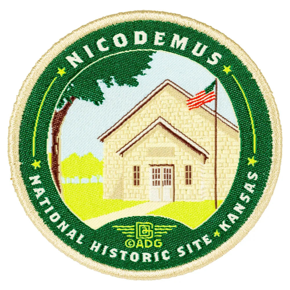 Circular patch with a house illustration and text about Nicodemus National Historic Site, Kansas.
