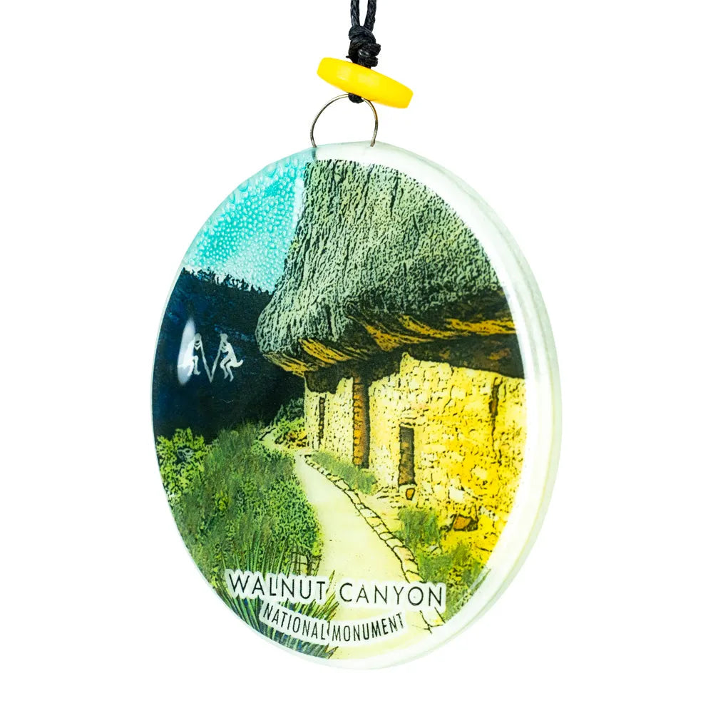 Round ornament with Walnut Canyon National Monument design on a white background