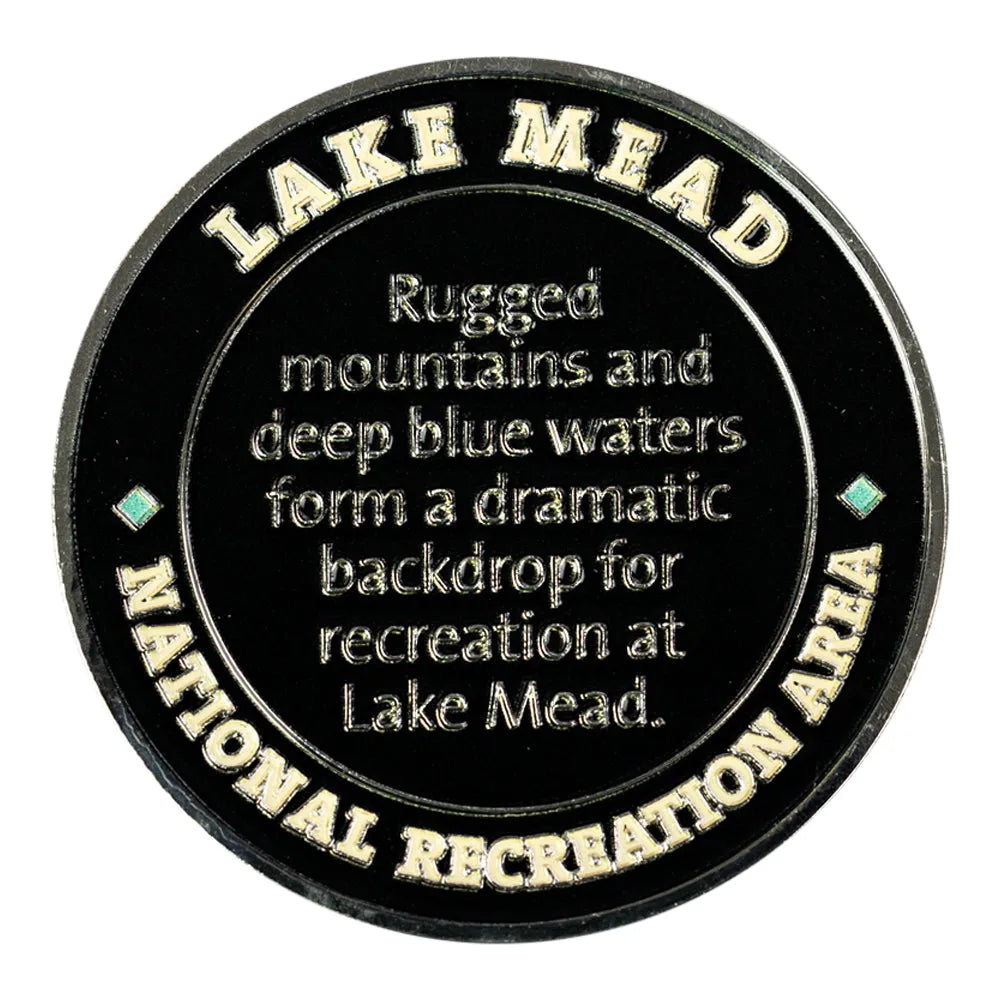 Round black plaque with gold text about Lake Mead National Recreation Area.