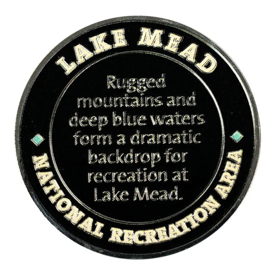 Round black plaque with gold text about Lake Mead National Recreation Area.