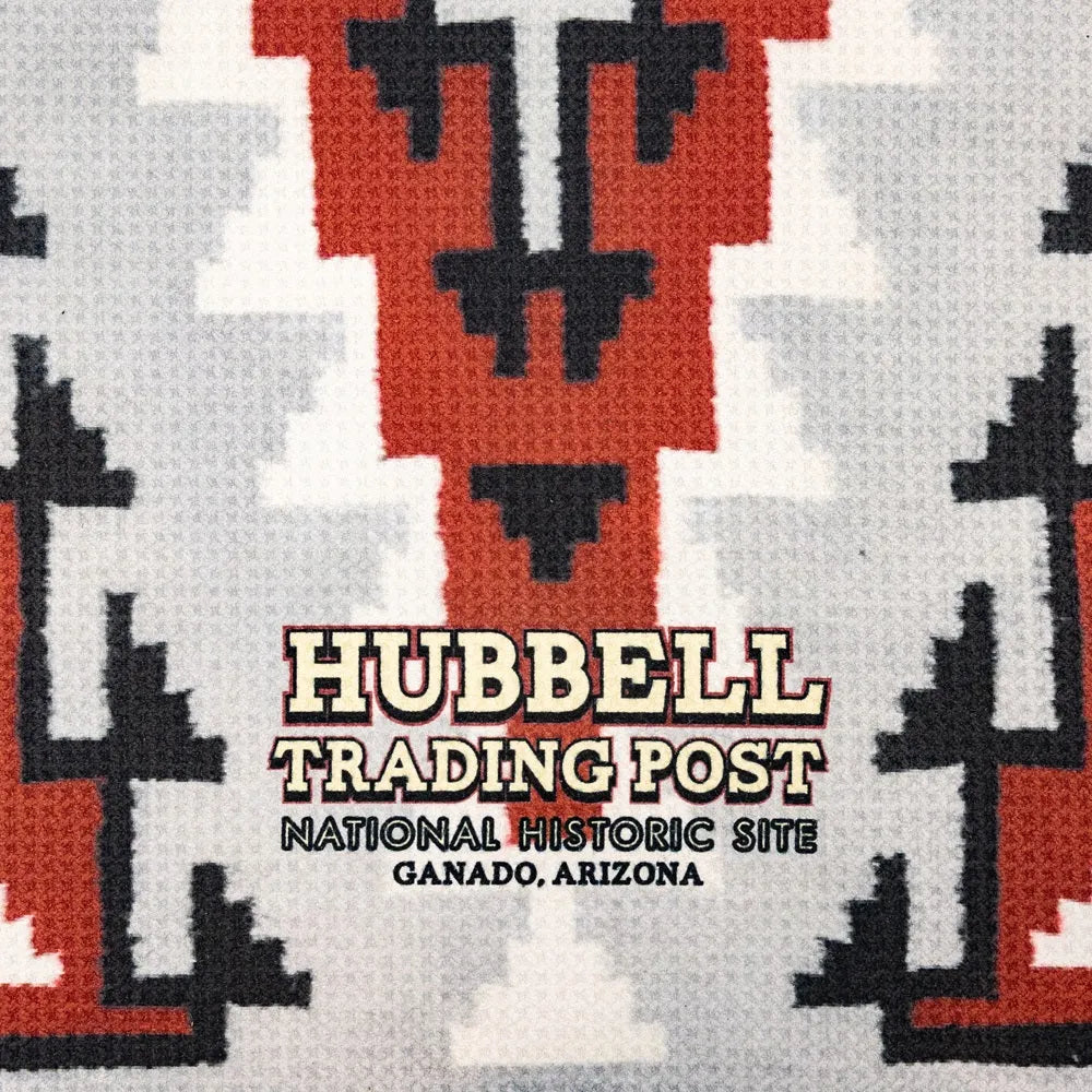 Patterned fabric with Hubbell Trading Post branding and location text.