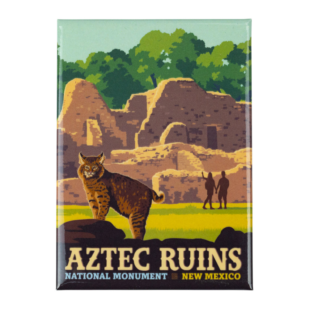 Fridge magnet with Aztec Ruins National Monument design featuring a lynx and people near ruins.