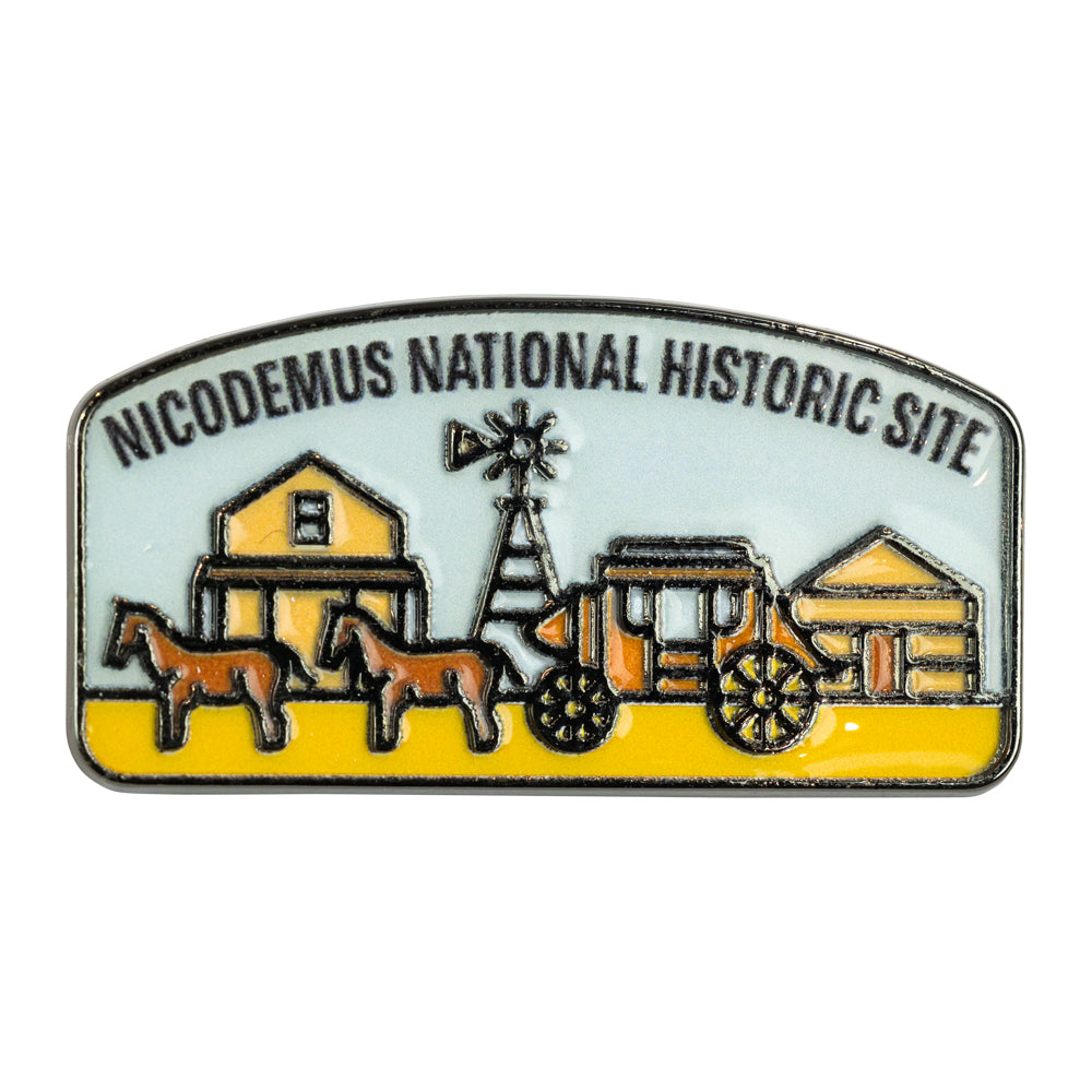 Pin with illustration of a wagon and buildings labeled 'Nicodemus National Historic Site'.