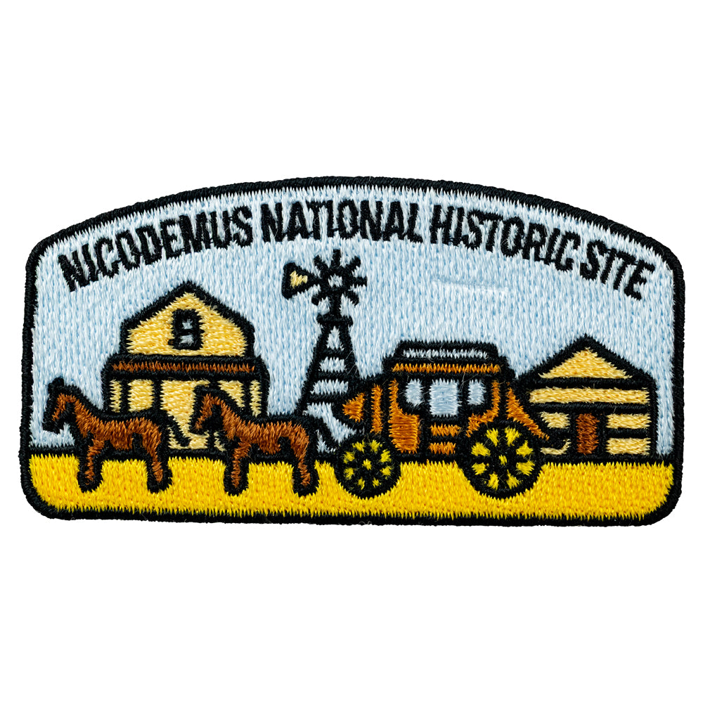 Embroidered patch of Nicodemus National Historic Site with a wagon, barn, and windmill.
