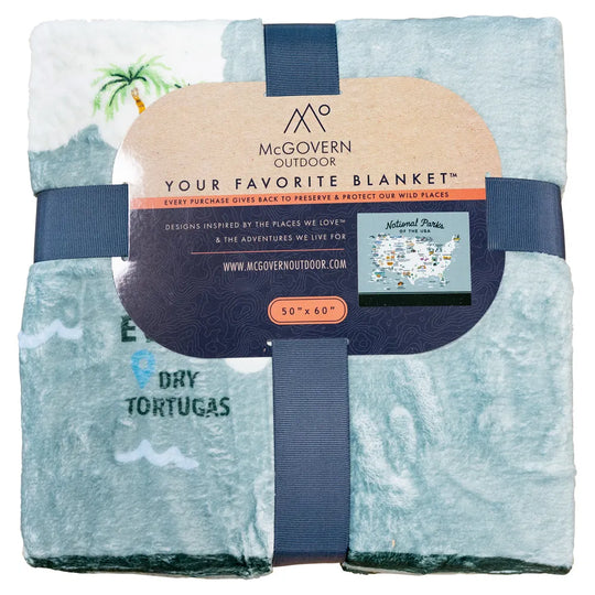 Folded blanket with McGovern Outdoor branding and design elements.