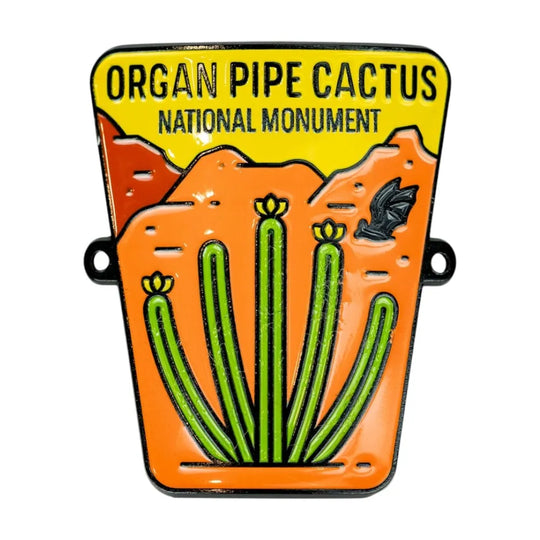 Enamel hiking stick medallion with Organ Pipe Cactus National Monument design on a white background