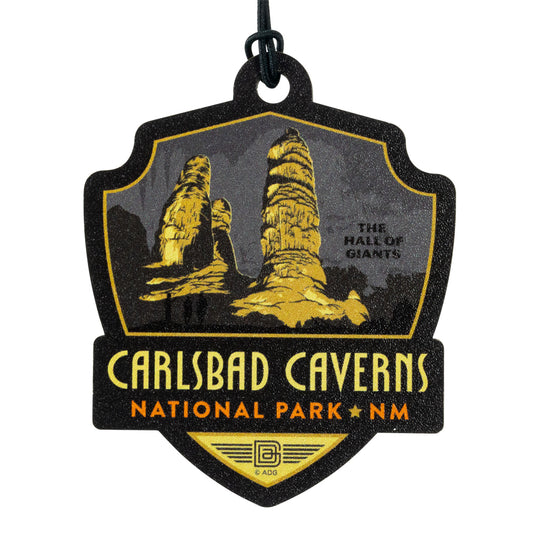 Carlsbad Caverns National Park badge with rock formations and text on a black background