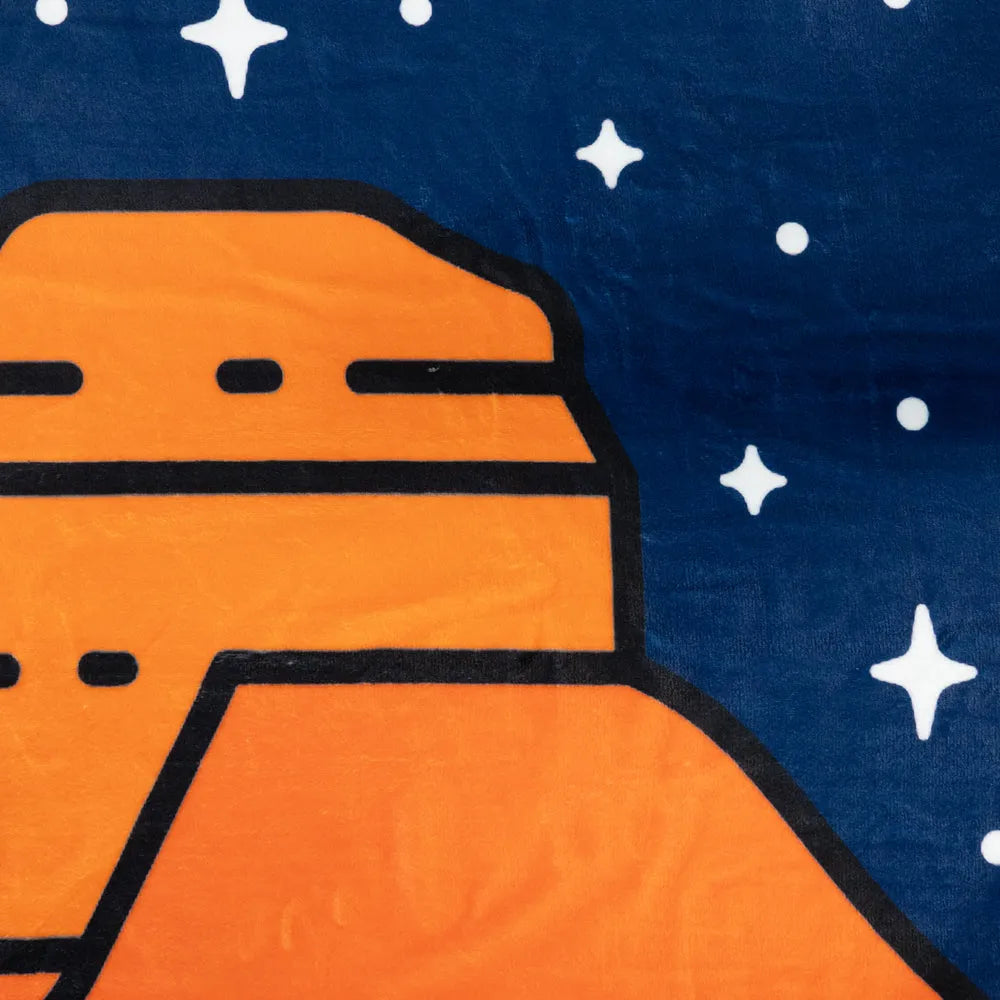 Illustration of a ancestral puebloan site on a blue background with stars