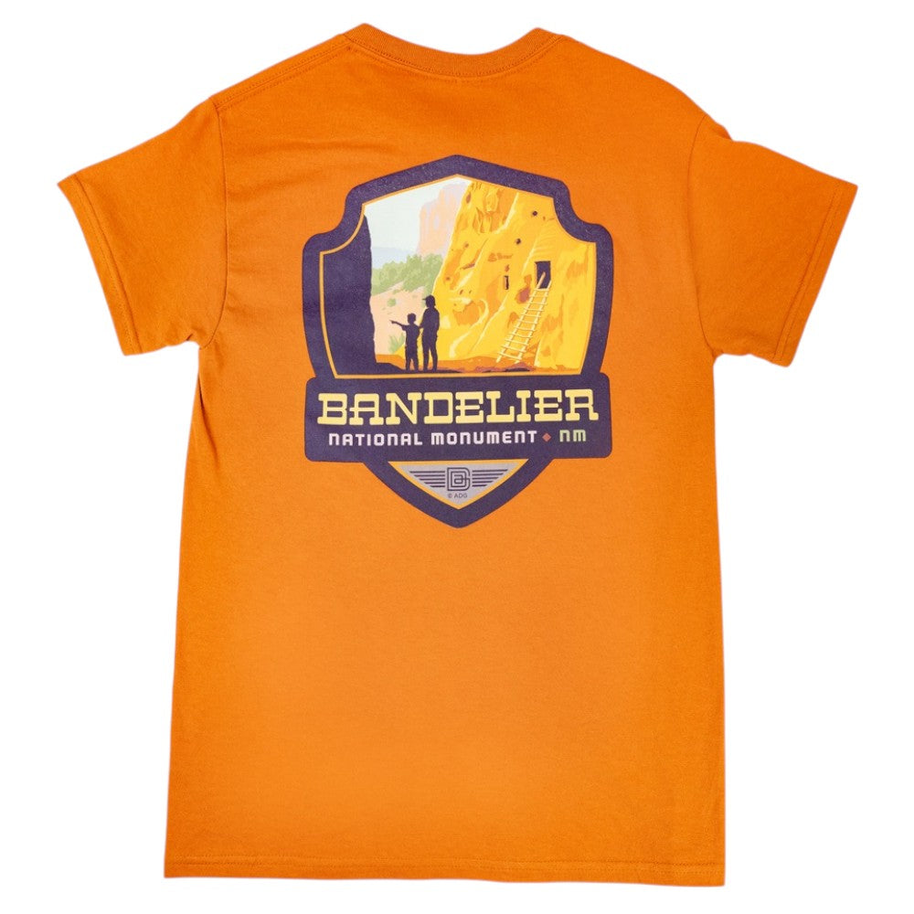 Orange t-shirt with Bandelier National Monument graphic on a white background