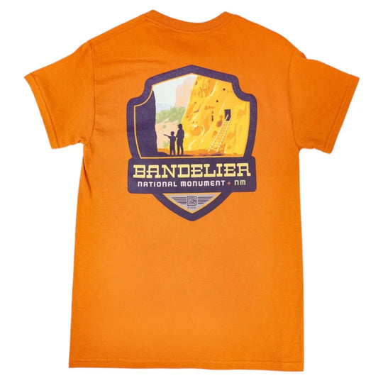 Orange t-shirt with Bandelier National Monument graphic on a white background