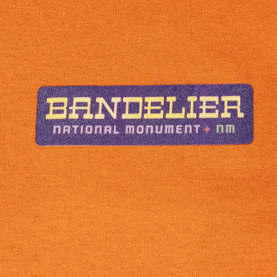Close up of the 'Bandelier National Monument' text on the front of the shirt.