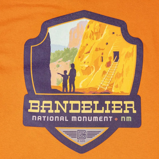 Logo of Bandelier National Monument on an orange background