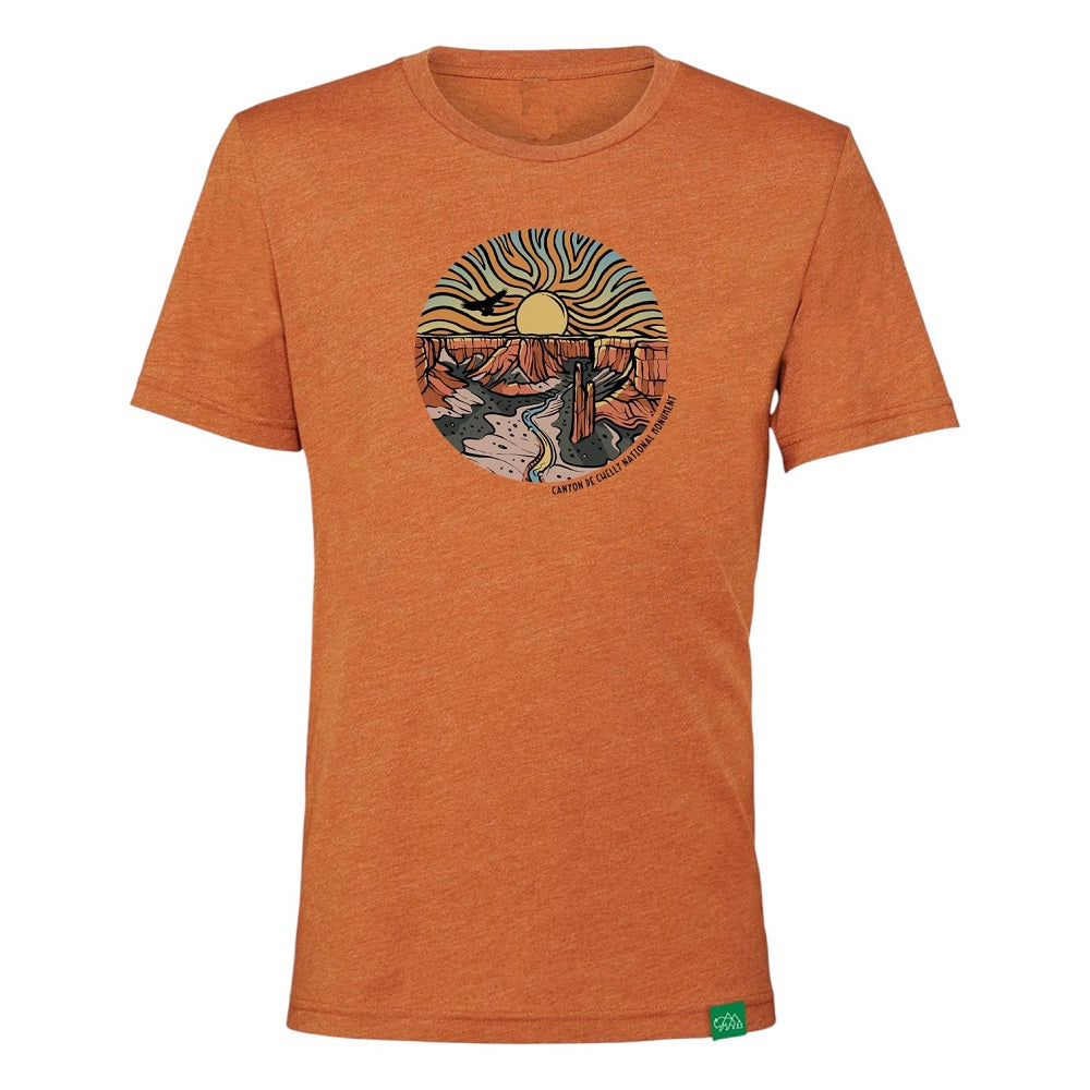 Orange t-shirt with a colorful graphic design of Canyon de Chelly National Monument on a white background
