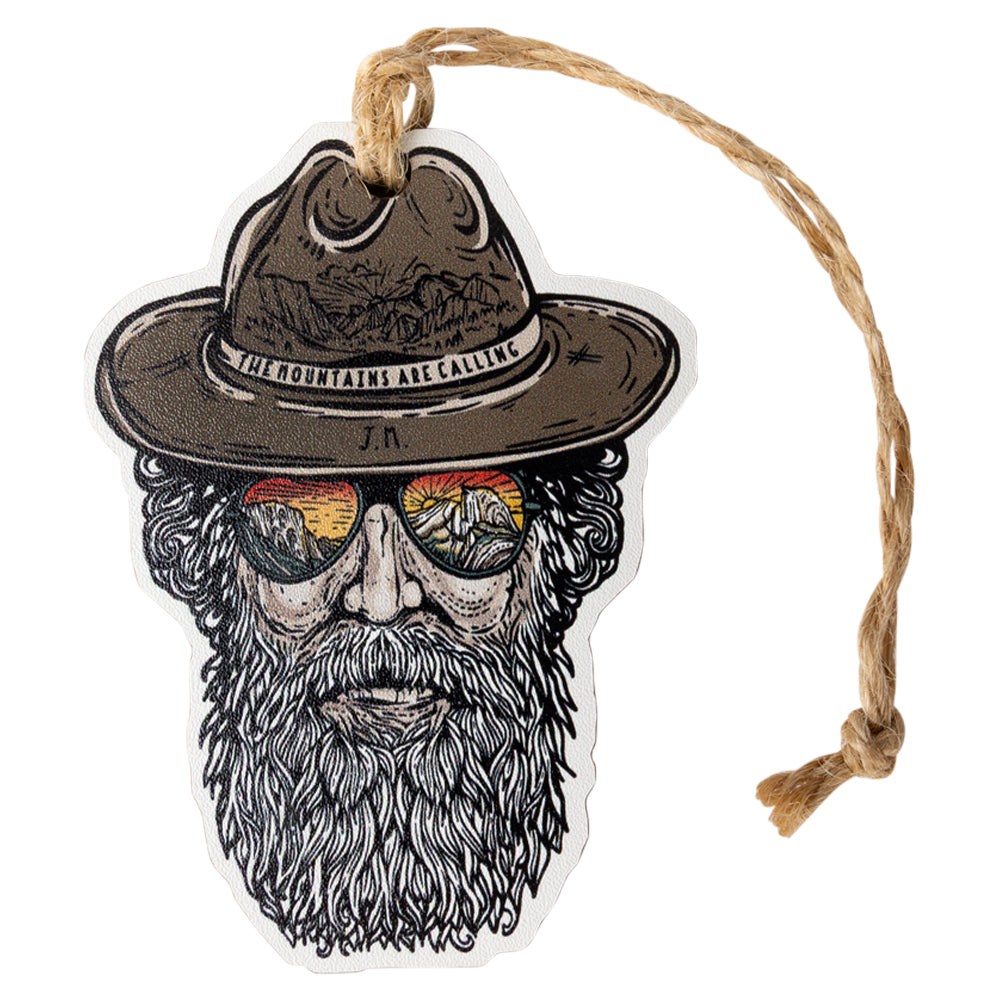 Ornament with a design of a bearded man wearing a hat and sunglasses with 'The mountains are calling' text on the hat.