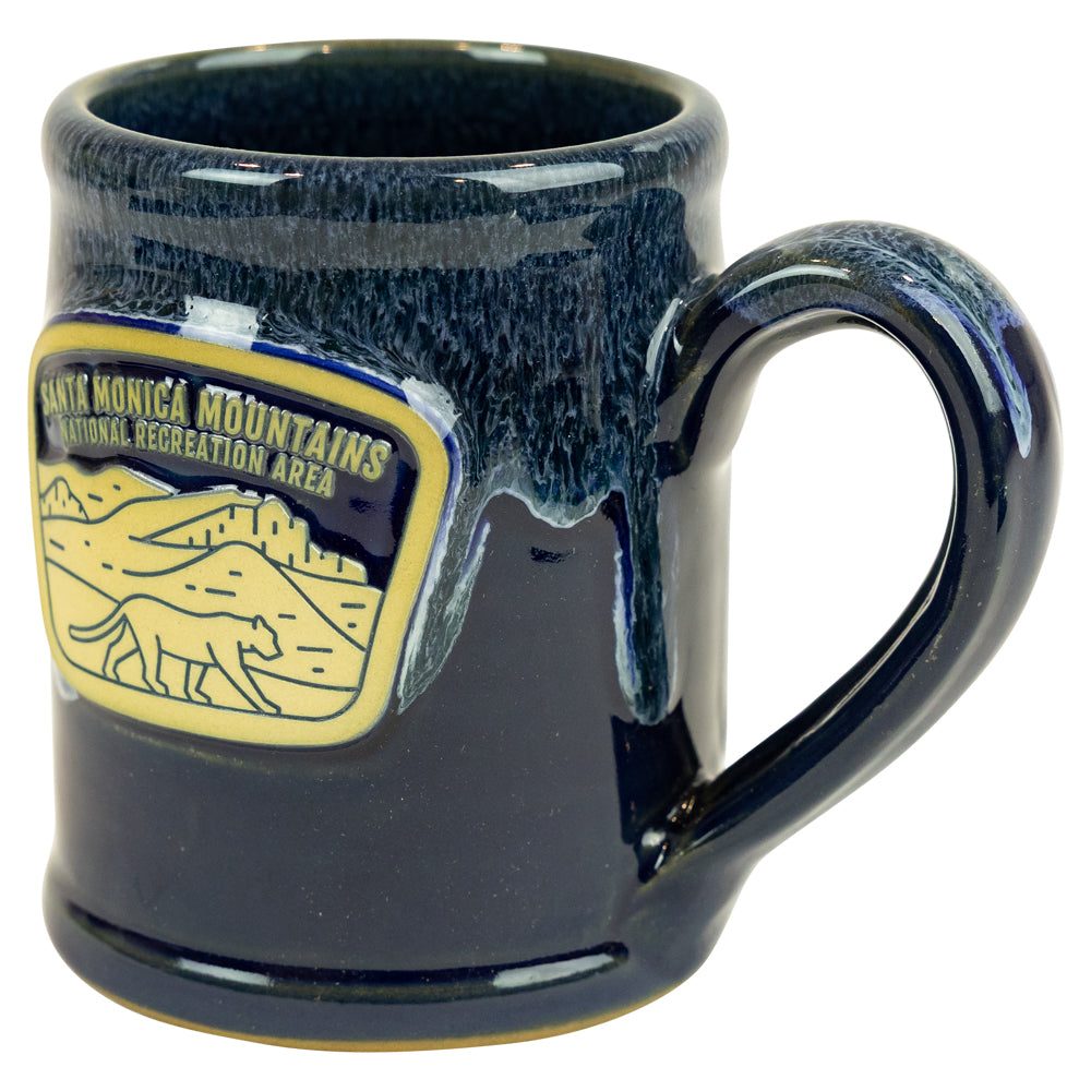 Navy blue mug with Santa Monica Mountains National Recreation Area logo on a white background