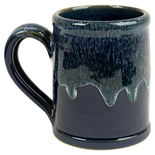 Blue ceramic mug with a textured surface on a white background