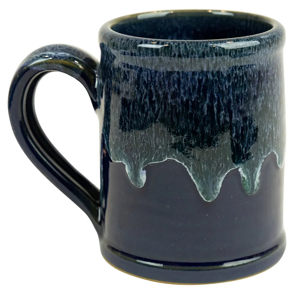 Blue ceramic mug with a textured surface on a white background