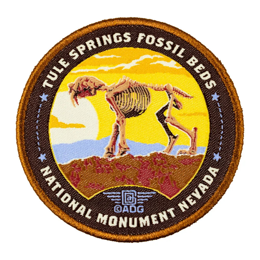 Circular patch with Tule Springs Fossil Beds National Monument Nevada design featuring a fossilized skeleton.