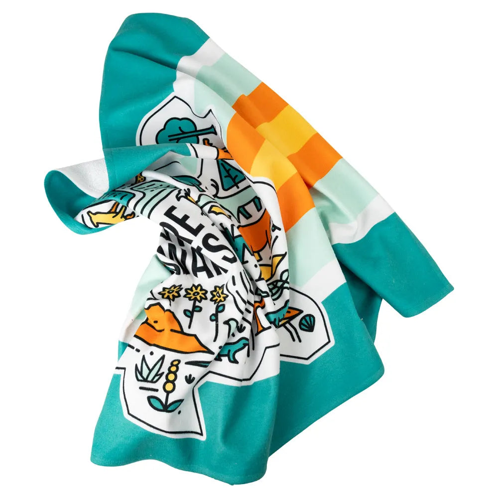Adventure Awaits National Park Beach Towel tossed on table