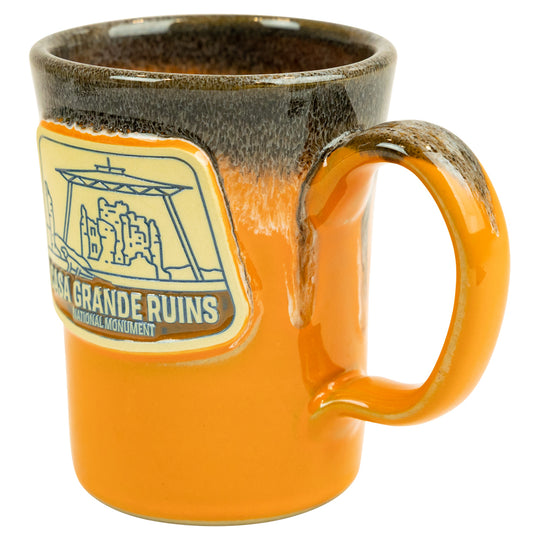 Orange mug with a logo and text on a white background