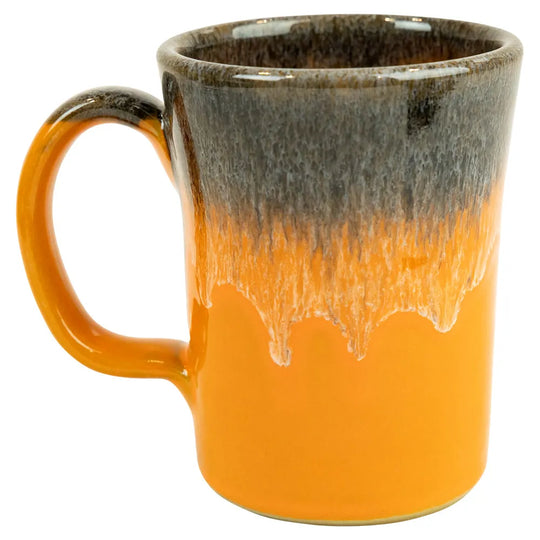 Ceramic mug with gradient from brown to orange on a white background