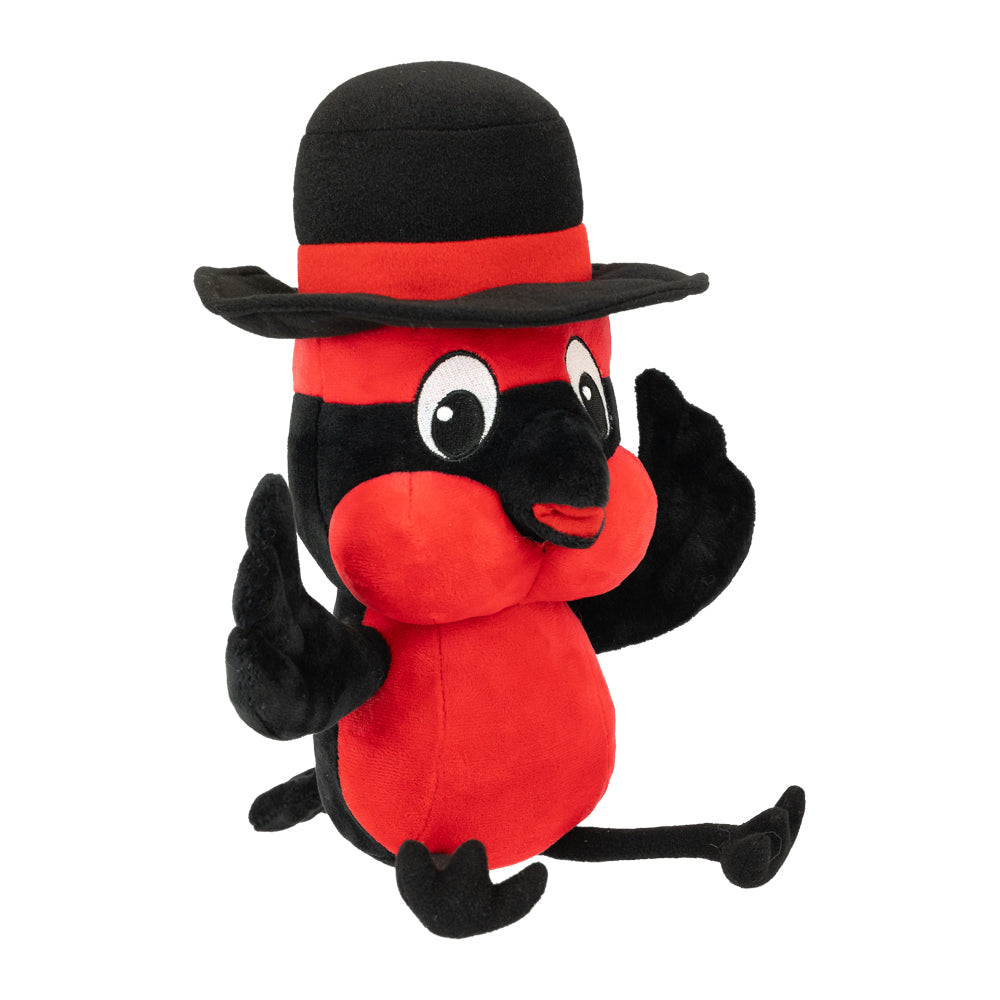 Red plush toy with a black hat and black gloves on a white background