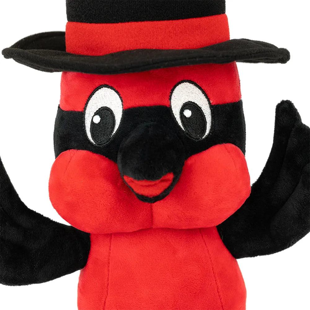 Red plush toy with black top hat and wings on a white background