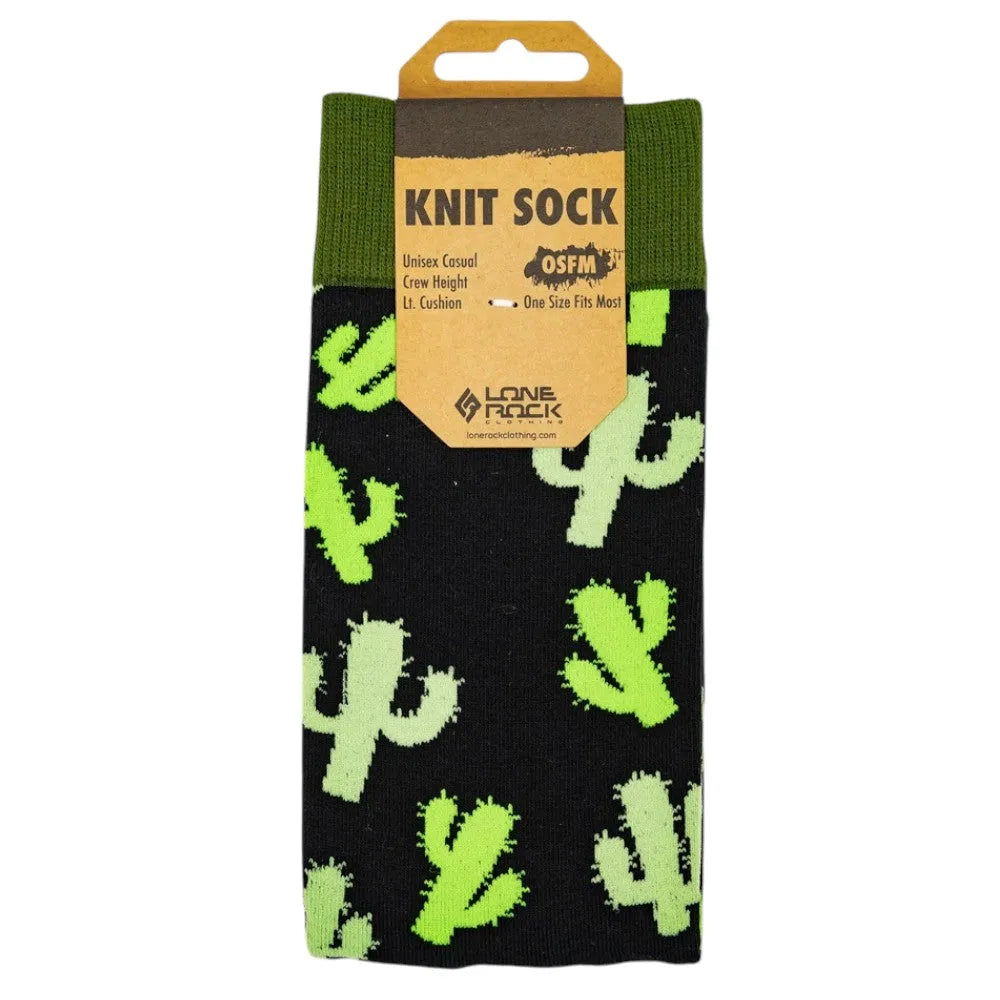 Knit sock with various shades of green saguaro cacti pattern against a black ground set against a white backdrop