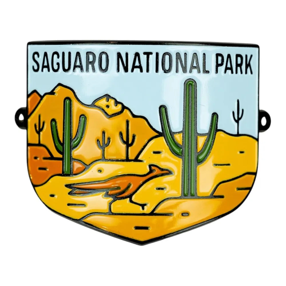 Saguaro National Park logo hiking stick medallion with desert landscape and cacti.
