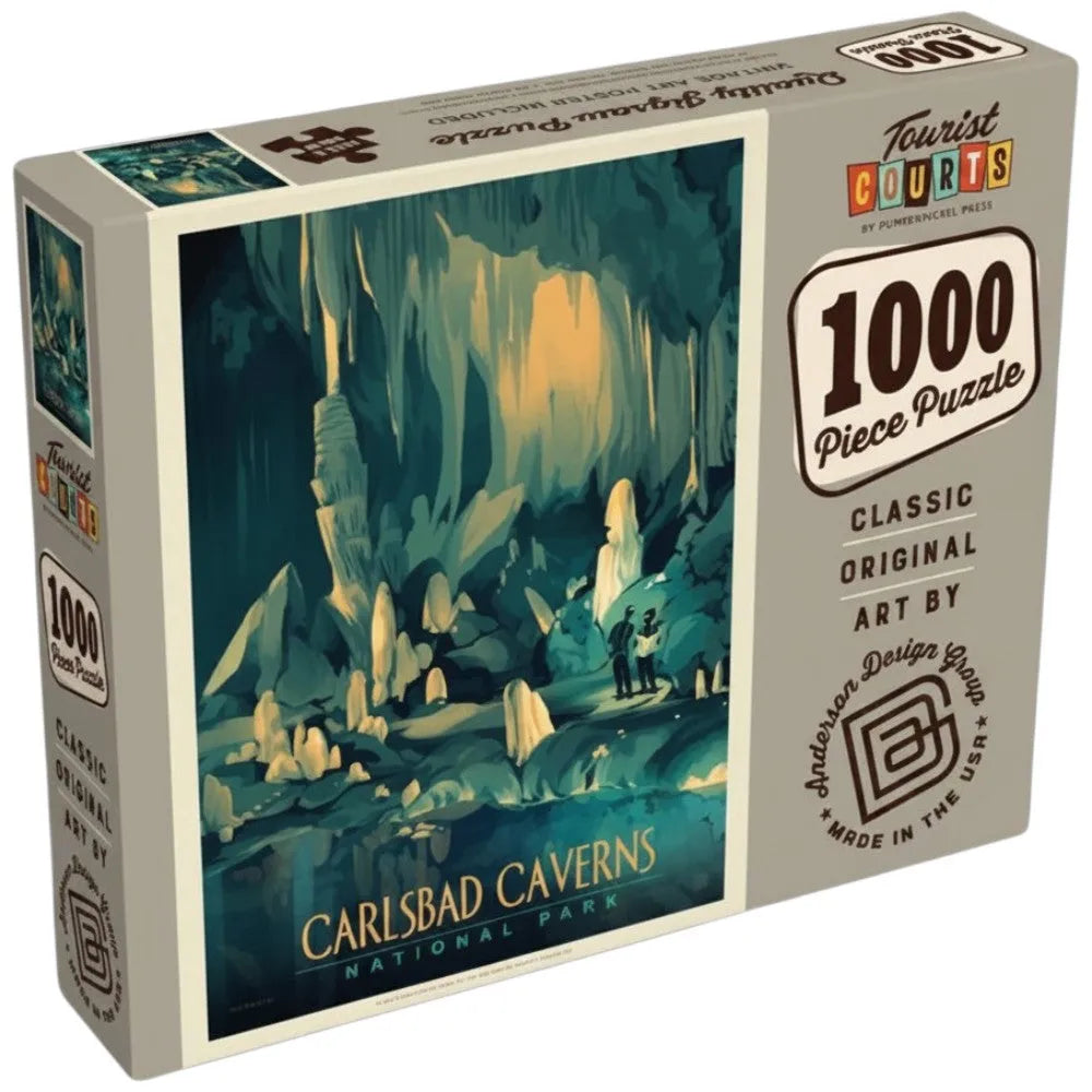 A 1000-piece jigsaw puzzle box featuring Anderson Design Group artwork of Carlsbad Caverns National Park. The box is light gray with a large illustrated cave scene in teal, blue, and yellow tones, and text on the front and side reads '1000 Piece Puzzle,' 'Classic Original Art,' and 'Carlsbad Caverns National Park.