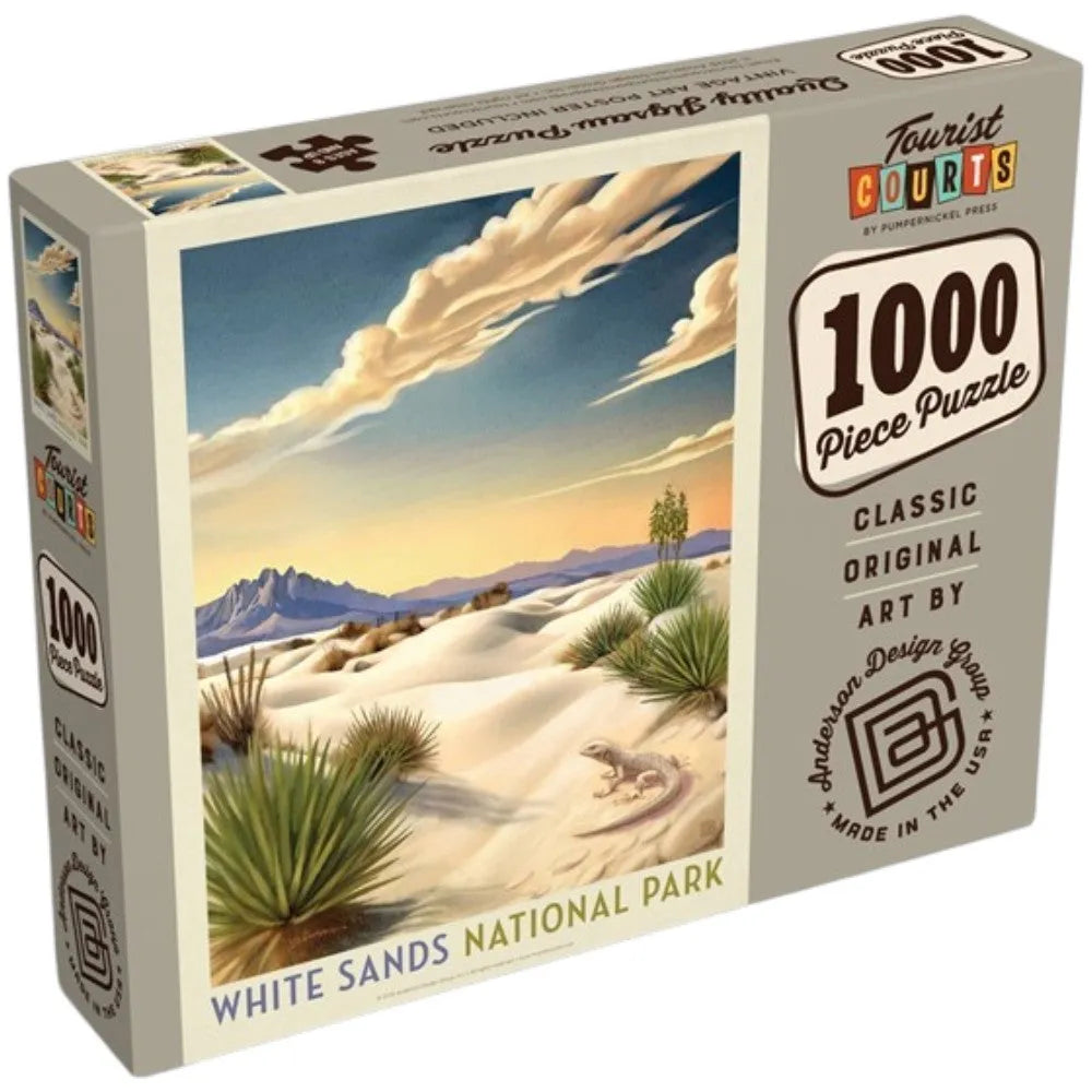 A 1000-piece jigsaw puzzle box featuring an illustration of White Sands National Park with sand dunes, yucca plants, mountains, and a blue sky with clouds.