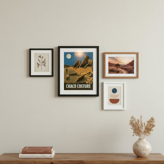 Chaco Culture National Historical Park framed print on wall with three other pieces and a wooden console beneath.