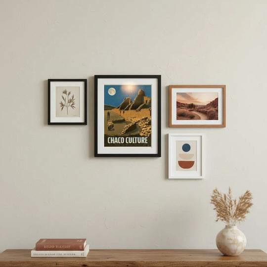 Chaco Culture National Historical Park framed print on wall with three other pieces and a wooden console beneath.