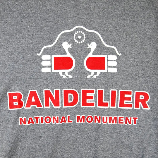 Gray t-shirt with Bandelier National Monument logo featuring two birds and red text on a gray background.