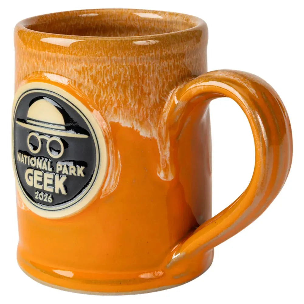 Orange mug with 'National Park Geek 2026' label on a white background