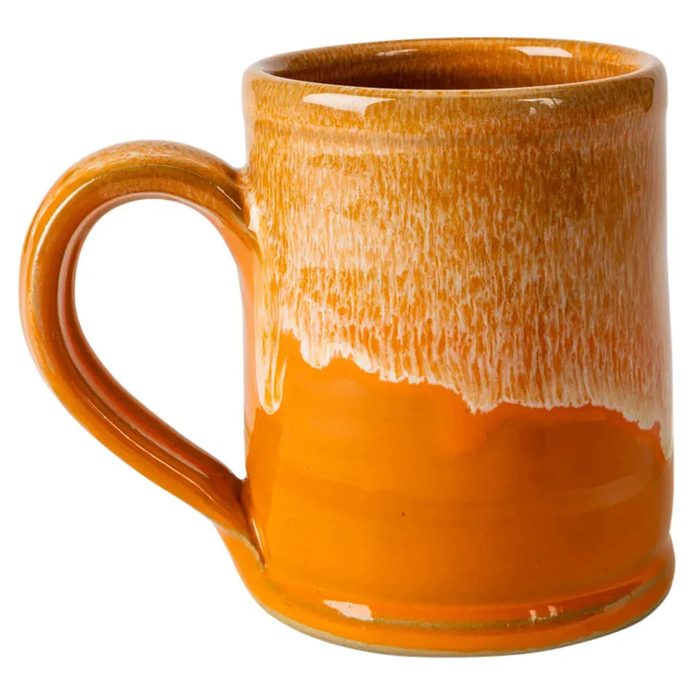 Orange ceramic mug with a textured surface on a white background