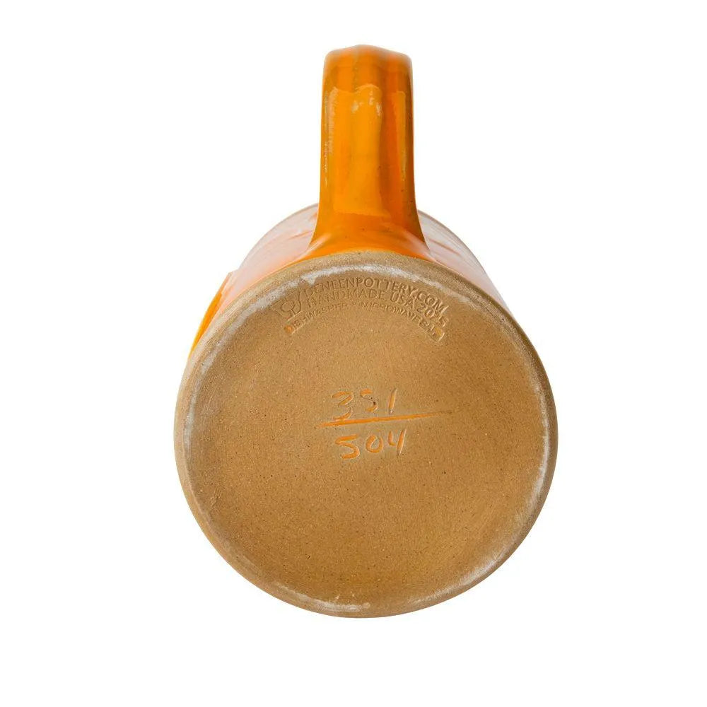 Sunset orange with a Dijon white glaze mug with a 'National Park Geek 2026' logo on a white background