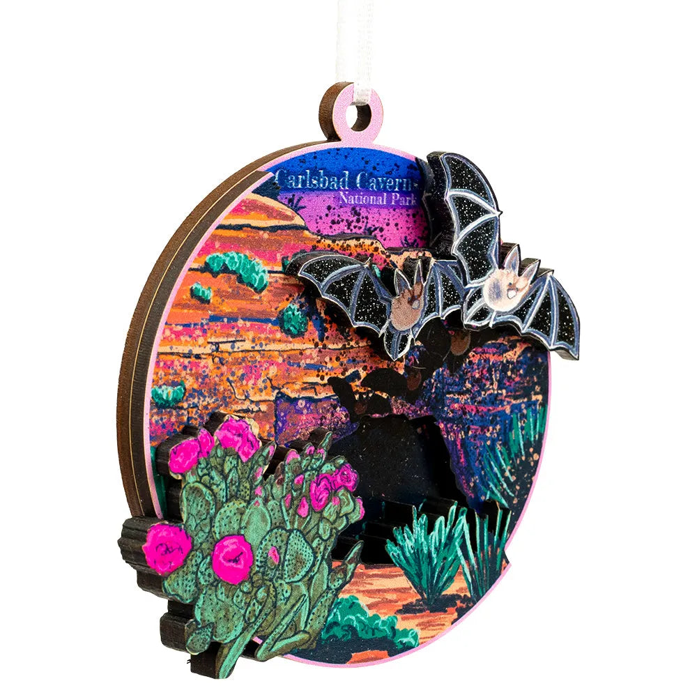 Decorative ornament with bats and cacti design, featuring Carlsbad Caverns National Park text.